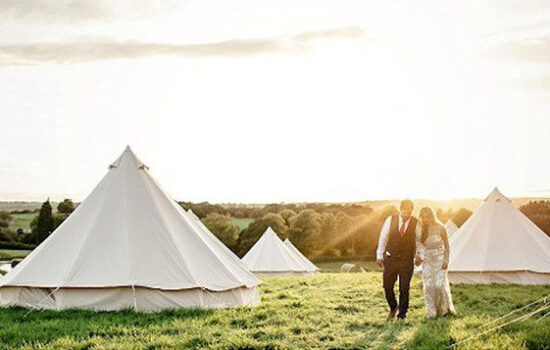 Stonor Park Accommodation Blue Bell Tents Couple Walking