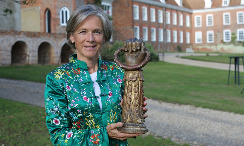 Elaine Binning with a carved wooden arm